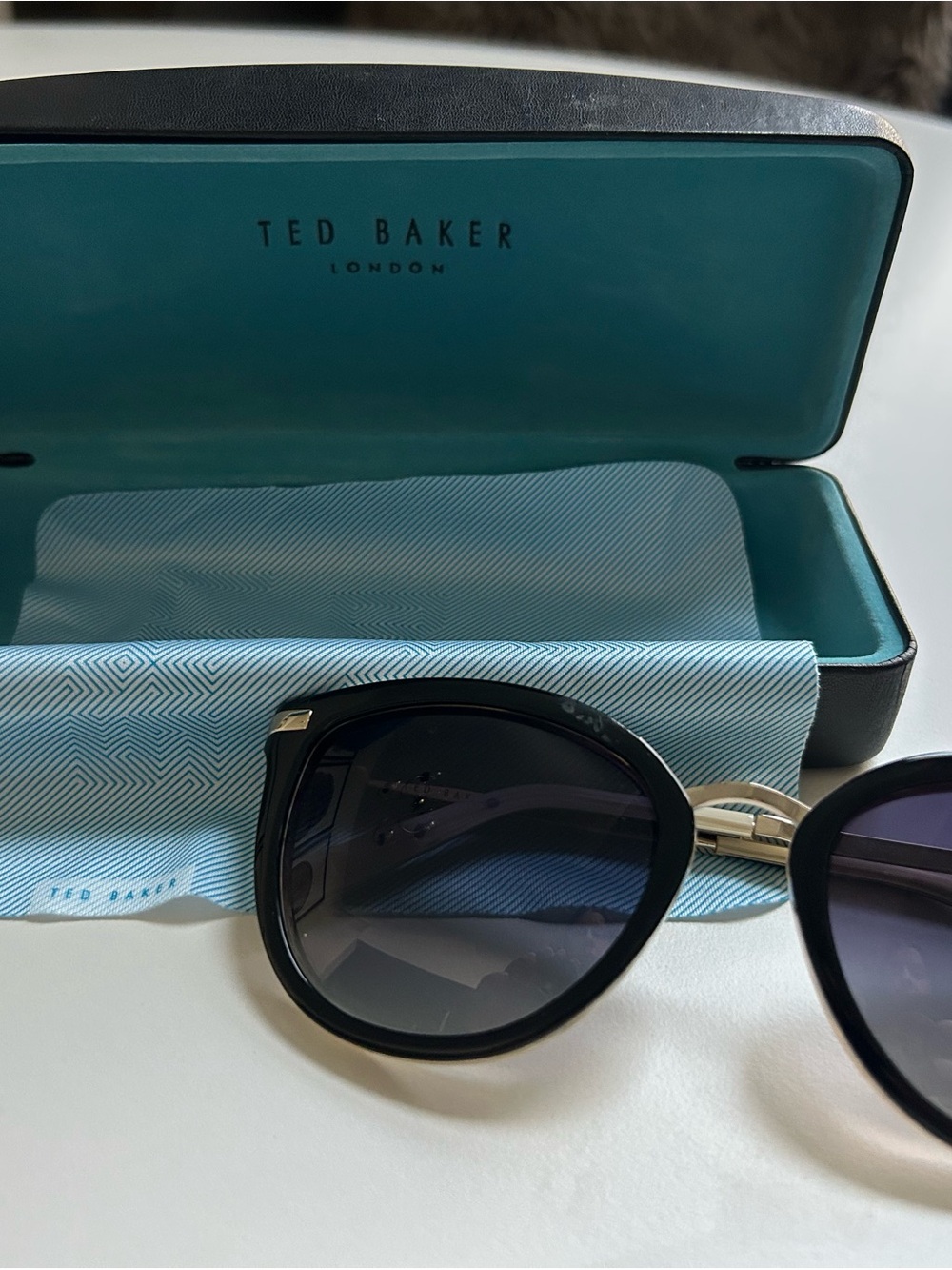Ted Baker Black Cat Eye Sunglasses with Gradient Lenses and Gold Accents